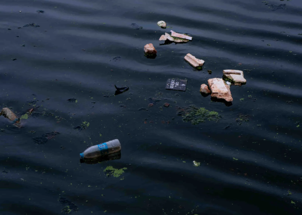 Floating garbage on river.