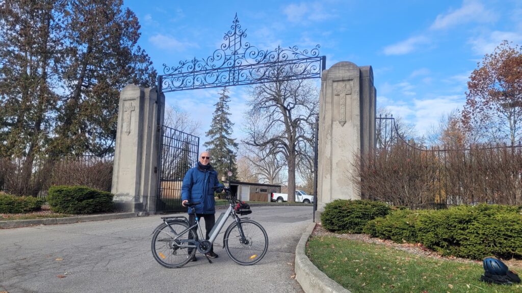 The author, just outside the gates to Woodland Cemetery.