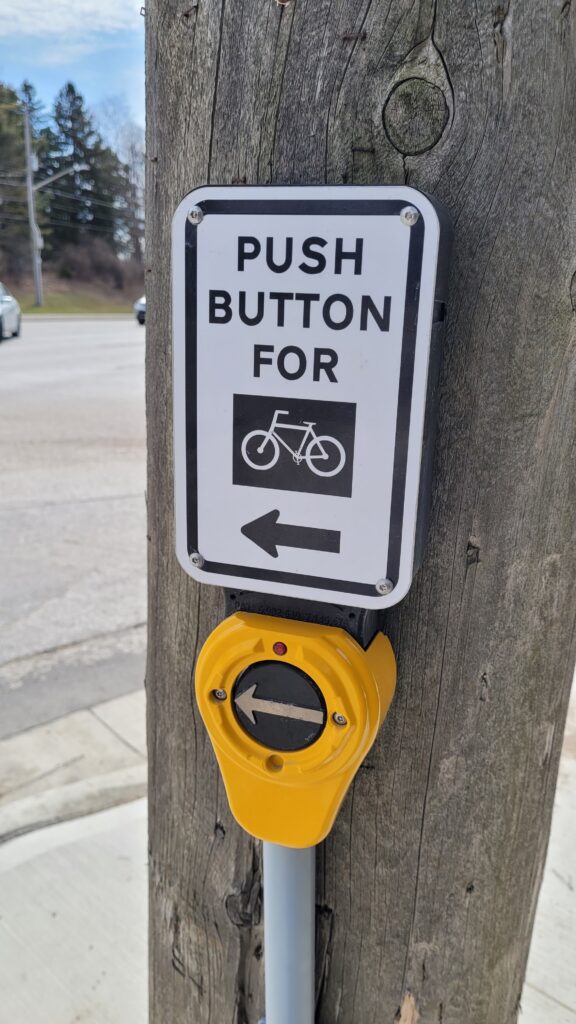 Push button for bicycle crossing.