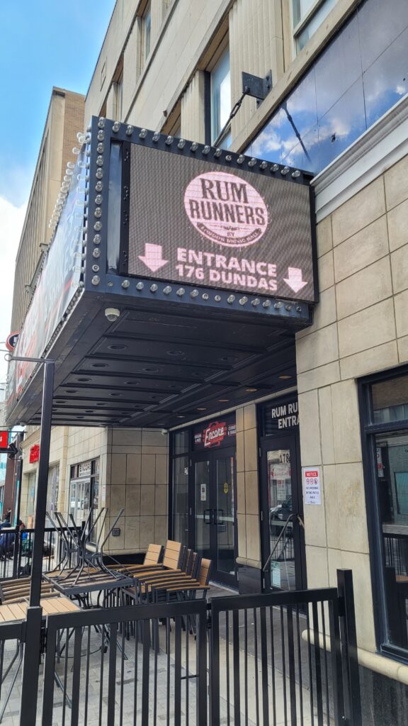 Sign outside of Rumrunners on Dundas St.