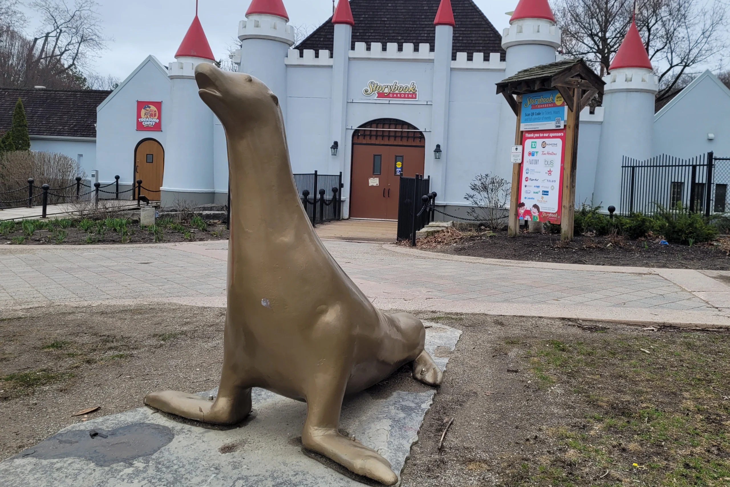 Statue of Slippery the sea lion at the entrance to Storybook Gardens.