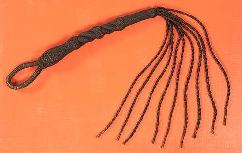 The cat-o'-nine-tails, a whip used by  the British to lacerate the skin and cause intense pain as punishment for soldiers who disobeyed an order. 