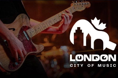 Logo of London City of Music in the foreground, guitar player in the background.