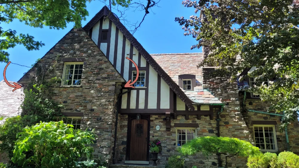 If you look closely, you'll see the gargoyles hiding under the eaves in this front view of the house.