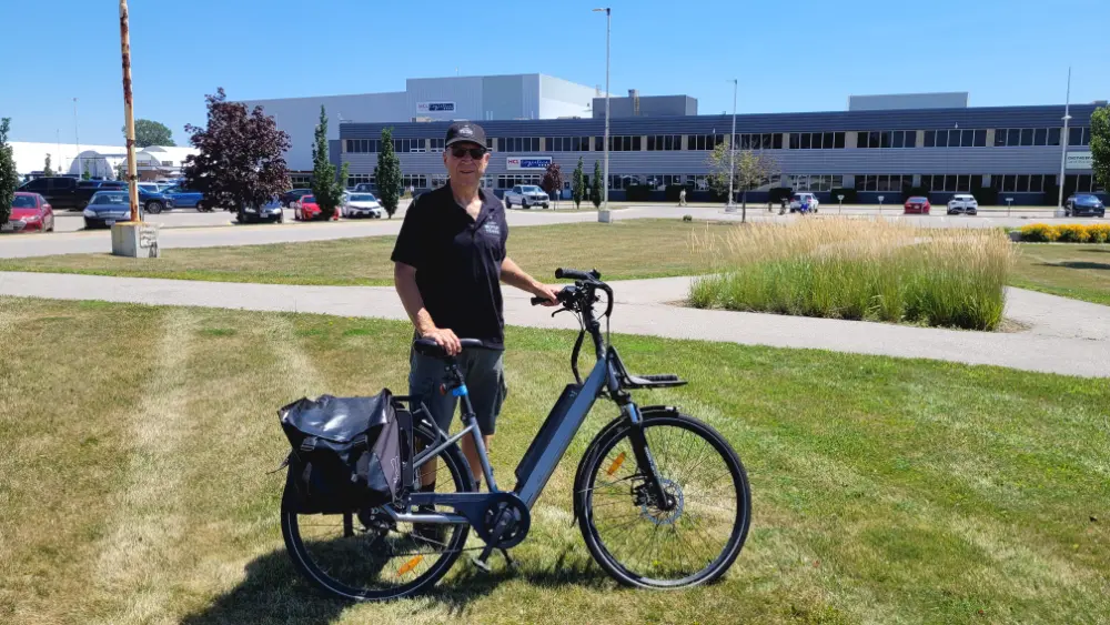 Lawrence Durham, author, standing in front of the old General Motors factory at 2021 Oxford Street East in London, Ontario.