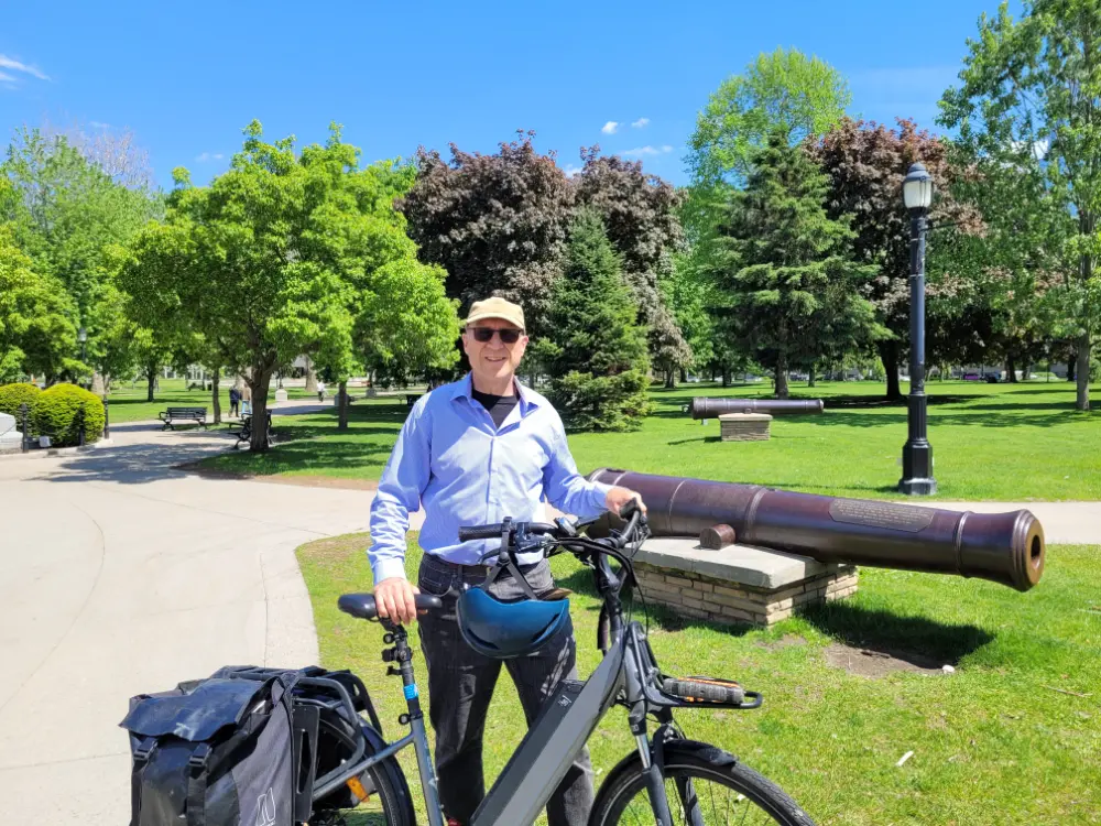 The author in Victoria Park, standing in front of one of three restored cannons from the British troop era. 