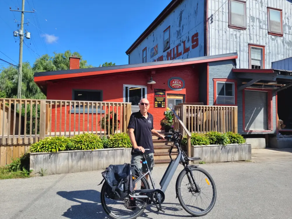 Lawrence Durham in front of the Arva Mills store.