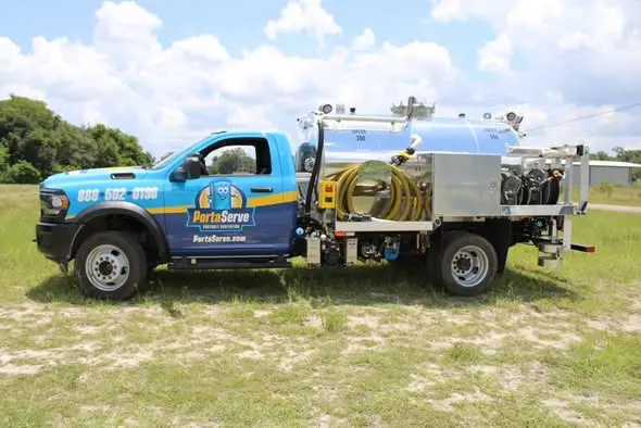 A modern-day honey wagon, actually a truck with a holding tank.