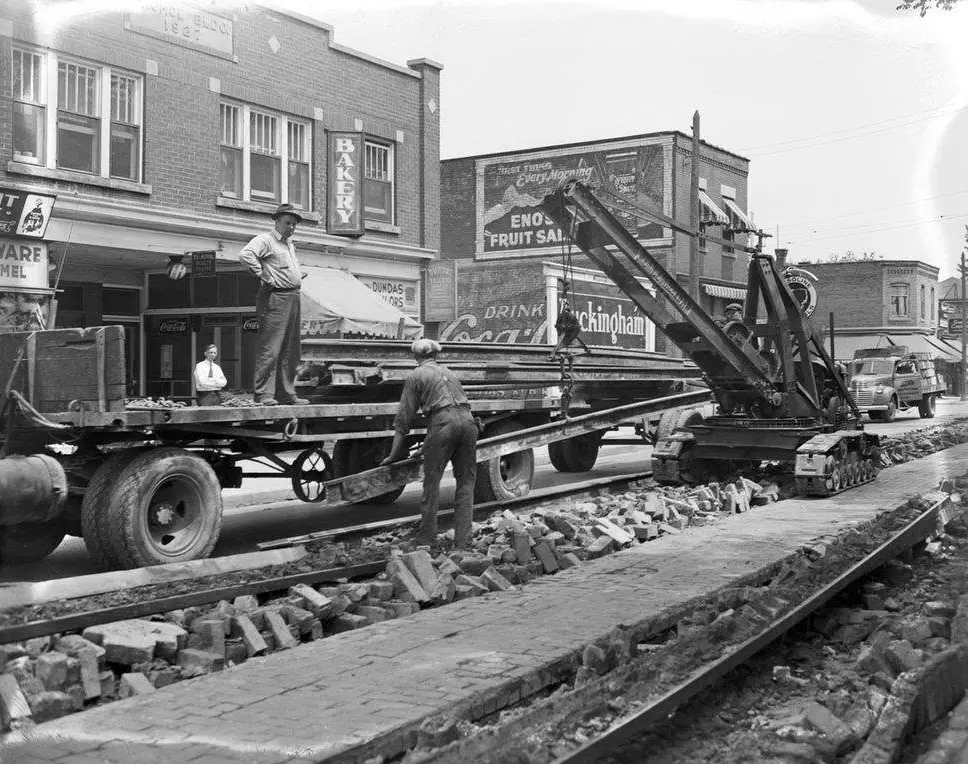 Workers remove streetcar tracks on Dundas St, in 1941.