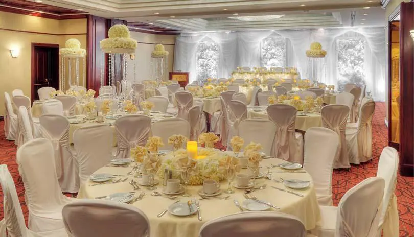 The Gunnery Ballroom on the main floor, showing multiple tables decorated for a wedding reception. 