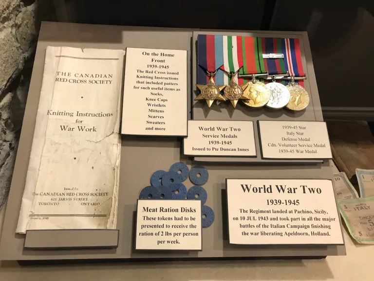 Display case showing military memorabilia.