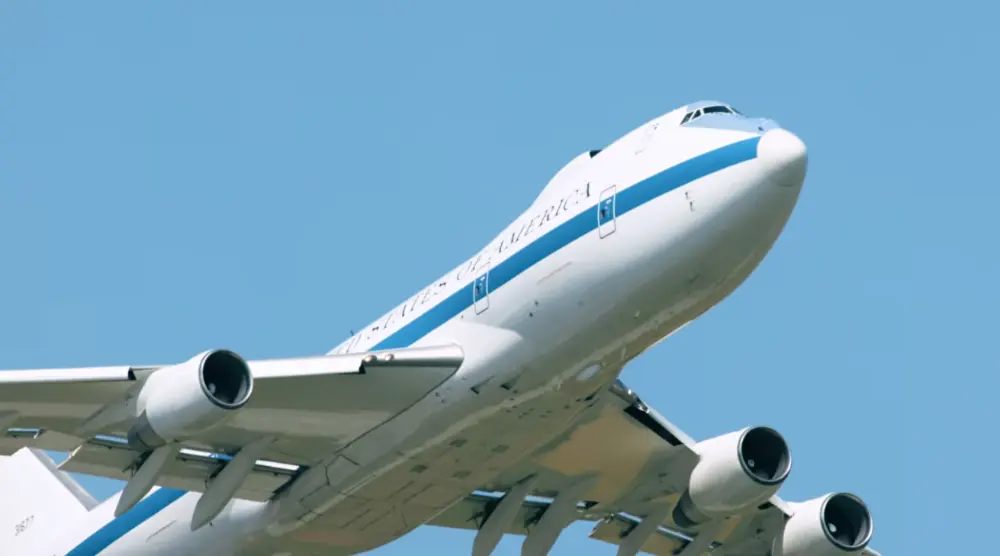 The large E-4B Nightwatch, famously known as the "Doomsday Plane" flying overhead.