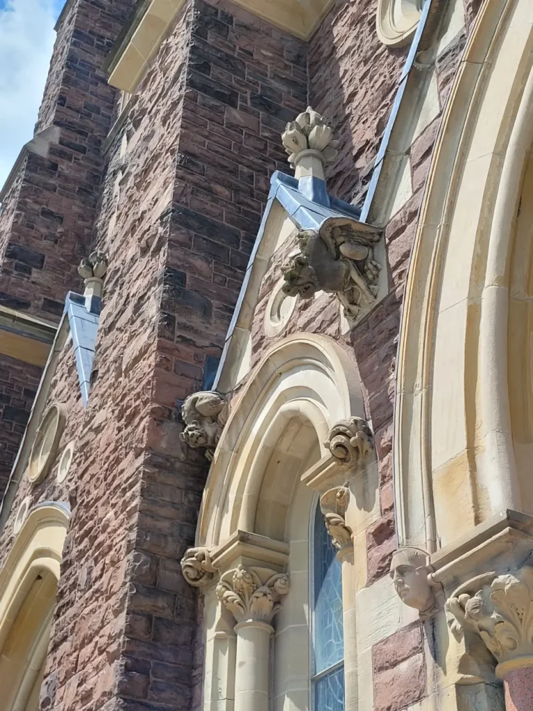 Carved grotesques appear on the front of St Peter's.