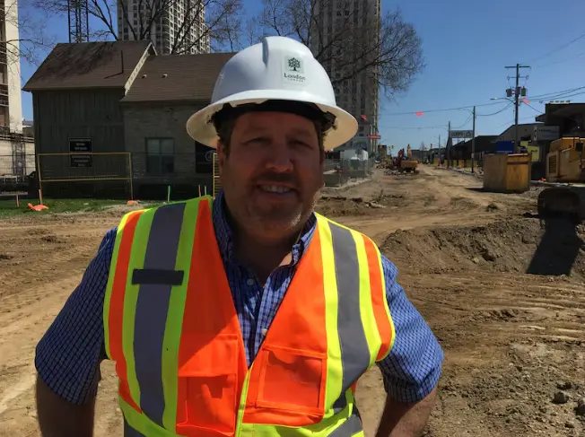 Larry Davidson, construction supervisor, in front of road construction on York Street.