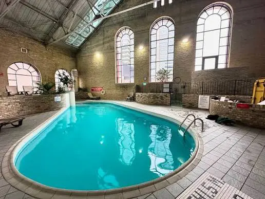 The pool area is located in the west wing of the Armouries, which formerly housed the cavalry unit. 
