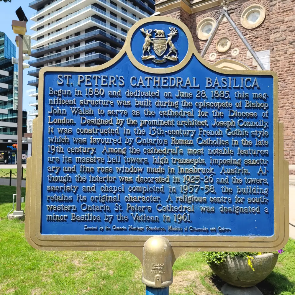 Historic plaque describing the story of St Peter's Cathedral Basilica.