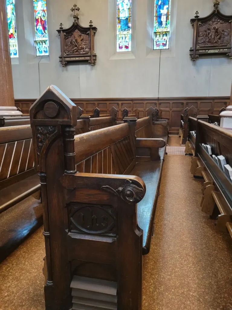 Rows upon rows of carved wooden pews.