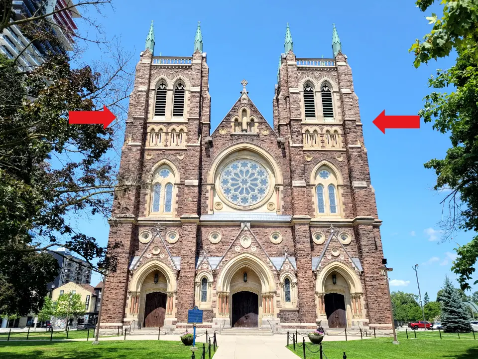 Arrows point to the transition between the old building and the new towers above it.