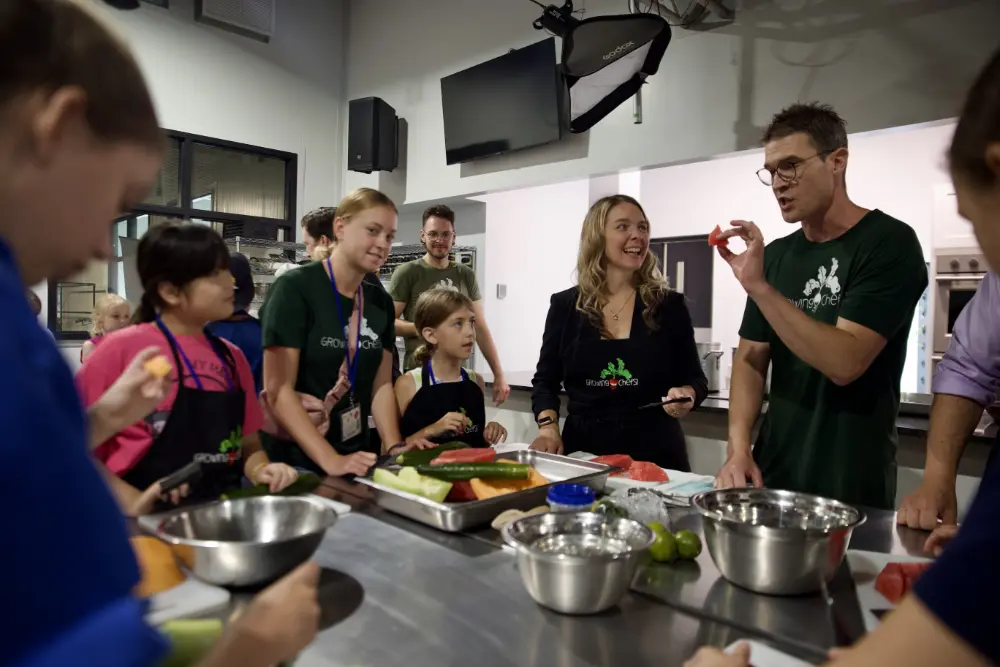Executive Director Andrew Fleet in his element, teaching children about food preparation.