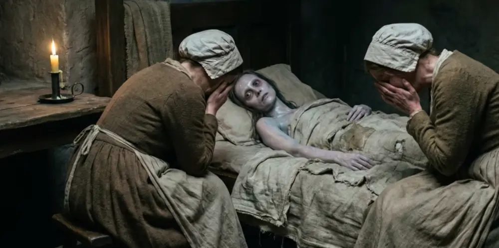 Two women crying over a young woman in bed dying of cholera. Dying woman is blue in complexion.