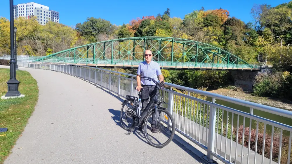 The author, standing in front of Blackfriars Bridge as the autumn leaves are about to show their colours. 
