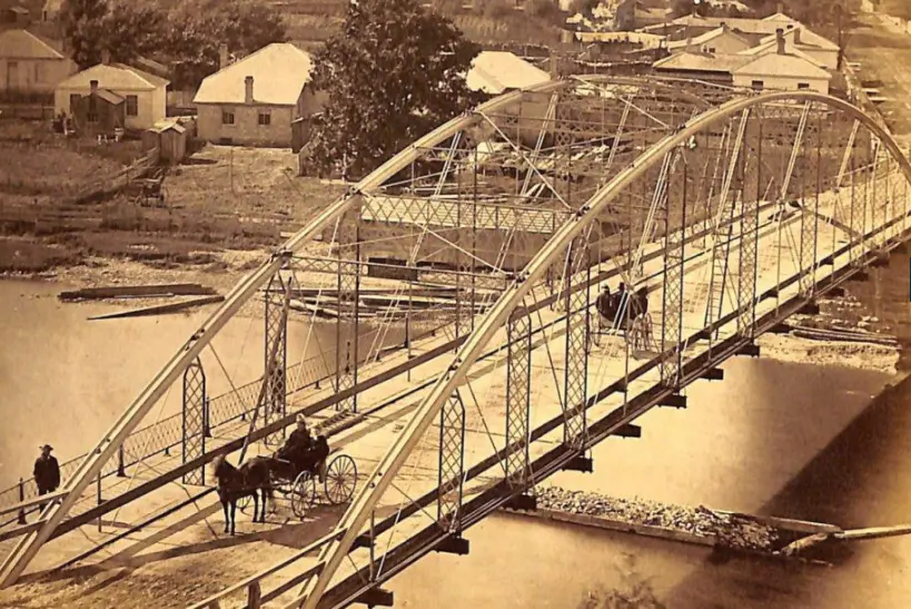 High angle view of Blackfriars Bridge in London, Canada with horses and buggies crossing it, c.  late1800s.